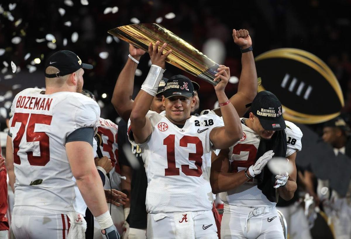 Quarterback Tua Tagovailoa of the Alabama Crimson Tide holds the trophy while celebrating with his team after defeating the Georgia Bulldogs in overtime to win the CFP National Championship last season. Tagovailoa sustained a sprained ankle Saturday night against Georgia, but he’ll be with the Tide on Dec. 29 when No. 1 Alabama faces No. 4 Oklahoma in the Capital One Orange Bowl CFP Semifinal.