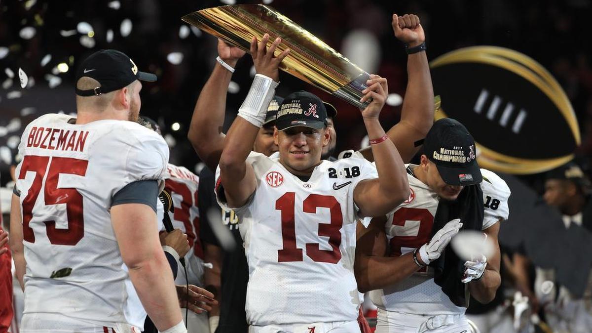 Quarterback Tua Tagovailoa of the Alabama Crimson Tide holds the trophy while celebrating with his team after defeating the Georgia Bulldogs in overtime to win the CFP National Championship last season. Tagovailoa sustained a sprained ankle Saturday night against Georgia, but he’ll be with the Tide on Dec. 29 when No. 1 Alabama faces No. 4 Oklahoma in the Capital One Orange Bowl CFP Semifinal.