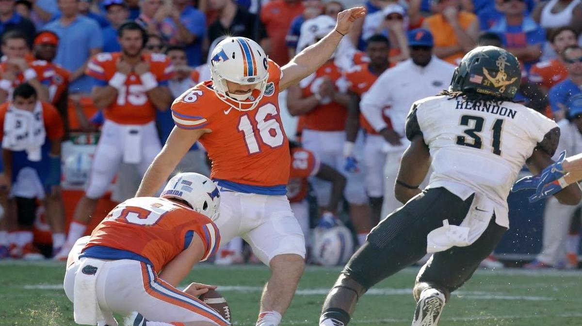 Florida place kicker Austin Hardin (16) kicks a 43-yard field goal as Vanderbilt cornerback Tre Herndon (31) tries for the block during the second half of an NCAA college football game, Saturday, Nov. 7, 2015, in Gainesville, Fla. Florida won 9-7.