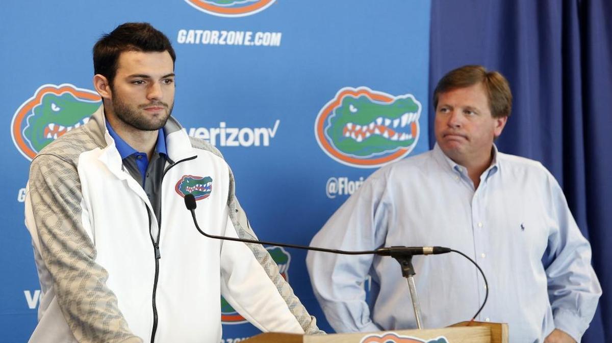 Florida Gators quarterback Will Grier, left, speaks to members of the media as head coach Jim McElwain listens Monday, Oct. 12, 2015, in Gainesville, Fla. Grier was suspended indefinitely for violating the NCAA's policy on banned performance-enhancing drugs.