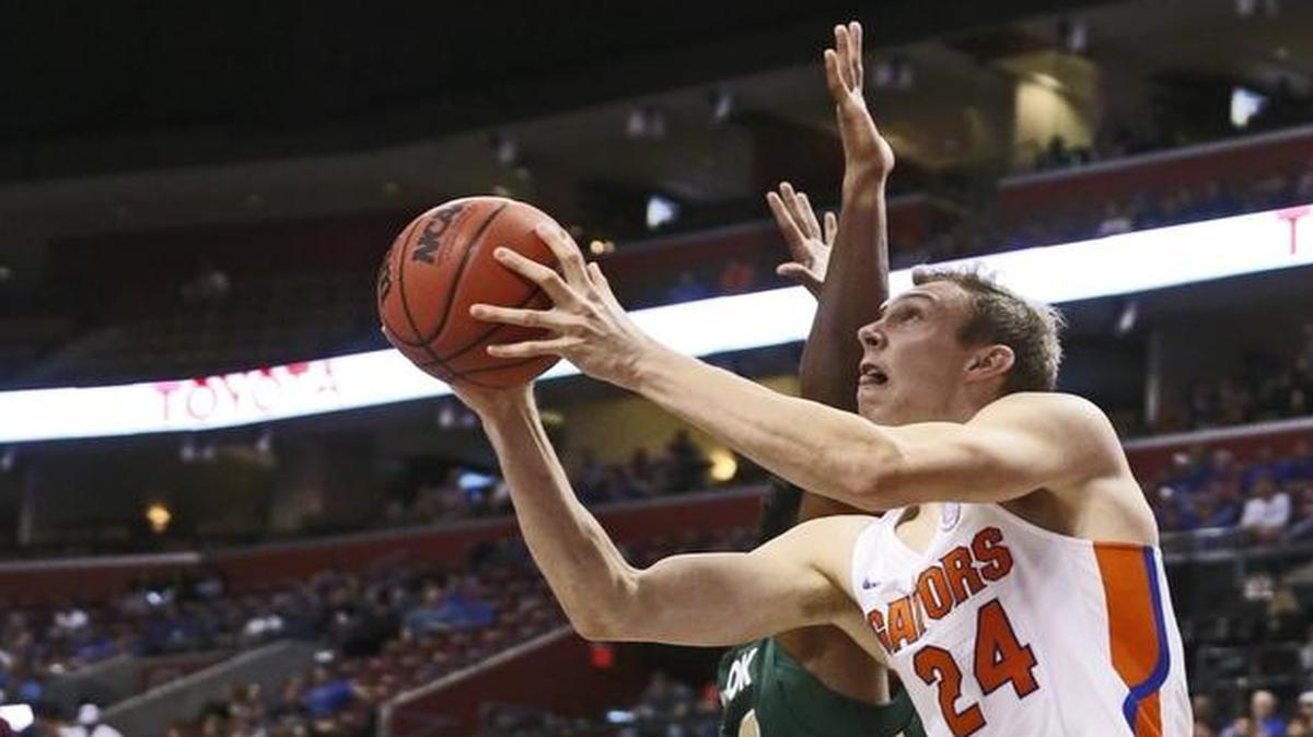 Florida Gators guard Canyon Barry (24) shoots from under the basket as the University of Florida plays Charlotte 49ers during the Orange Bowl Basketball Classic at BB&T Center.