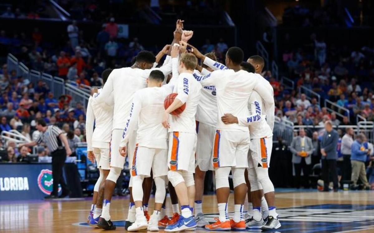 Florida players huddle before the start of the second round game against Virginia of the NCAA college basketball tournament, Sat., March 18, 2017 in Orlando, Fla.