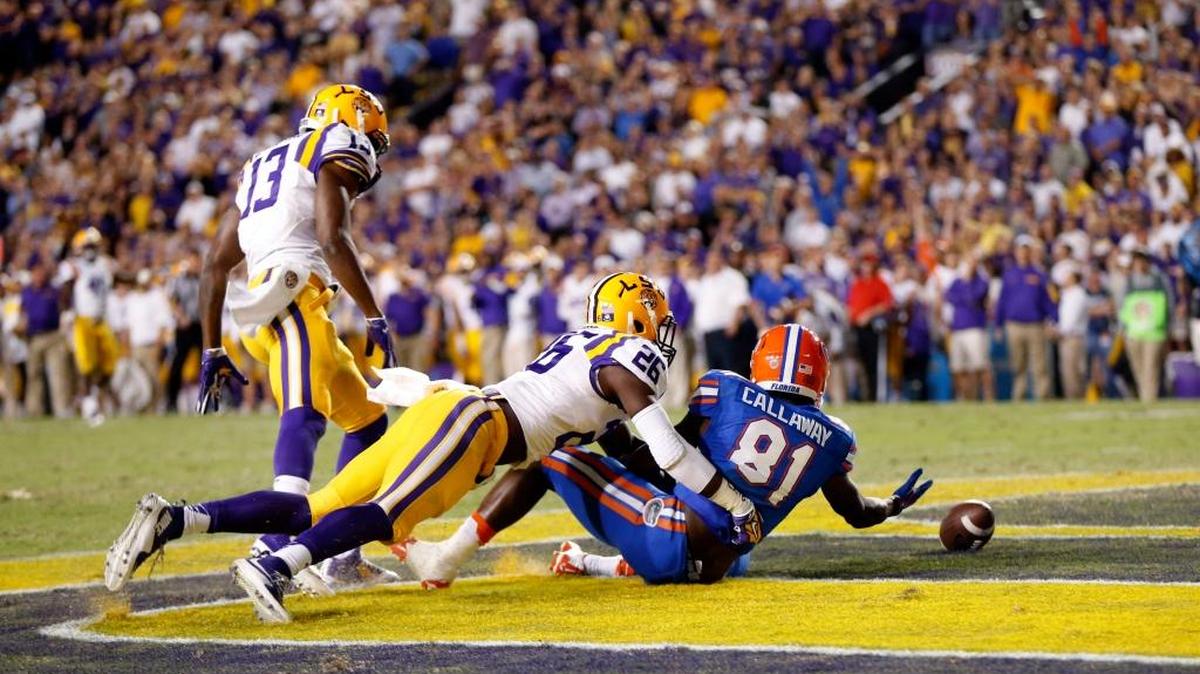 
Florida wide receiver Antonio Callaway (81) drops a pass in the end zone under pressure from LSU defensive back Dwayne Thomas (13) and safety John Battle (26) in the second half in Baton Rouge, La., Saturday, Oct. 17, 2015. LSU won 35-28. 
