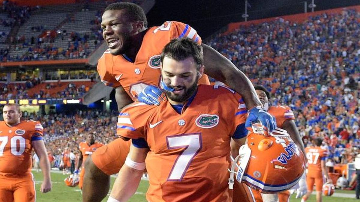 
Florida running back Kelvin Taylor celebrates by jumping on quarterback Will Grier (7) after their 38-10 win over Mississippi on Saturday, Oct. 3, 2015, in Gainesville, Fla. 
