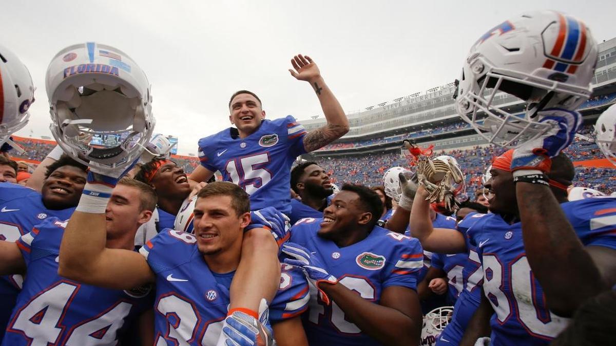 Florida place kicker Eddy Pineiro (15) sits on the shoulders of his teammates as they celebrate after defeating South Carolina 20-7 in an NCAA college football game, Saturday, Nov. 12, 2016, in Gainesville, Fla. Pineiro kicked two field goals in the game, including one for 54-yards.