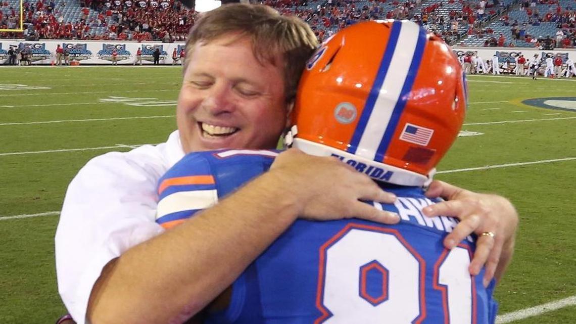 UF head coach Jim McElwain hugs wide receiver Antonio Callaway (81) after a 27-3 win against Georgia at EverBank Field in Jacksonville, Fla., on Saturday, Oct. 31, 2015.