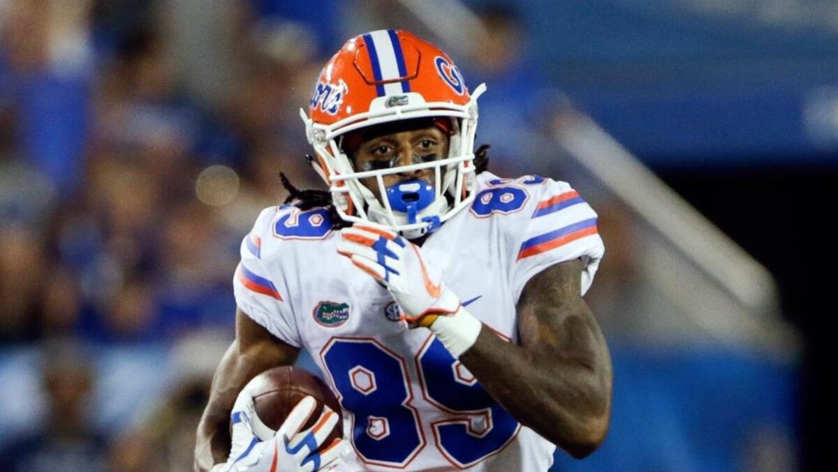 In this Sept. 23, 2017, file photo, Florida wide receiver Tyrie Cleveland runs the ball during the first half of an NCAA college football game against Kentucky in Lexington, Ky. Florida coach Jim McElwain expects to be without Cleveland against LSU on Saturday, a potentially significant loss for the 21st-ranked Gators. McElwain said Monday, Oct. 2, 2017, that Cleveland is wearing a walking boot on his right foot after badly spraining his ankle against Vanderbilt two days earlier.