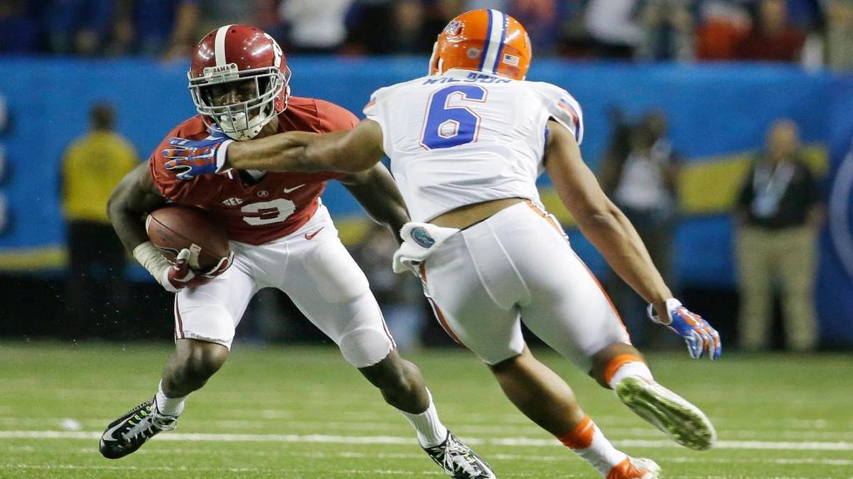 Alabama wide receiver Calvin Ridley (3) runs against Florida defensive back Quincy Wilson (6) during the second half of the Southeastern Conference championship NCAA college football game, Saturday, Dec. 5, 2015, in Atlanta. Ridley was injured on the play.