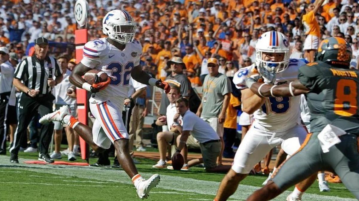Florida running back Jordan Cronkrite (32) runs for a touchdown during the first half of an NCAA college football game against Tennessee Saturday, Sept. 24, 2016, in Knoxville, Tenn.