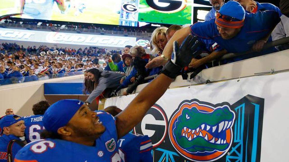 
Max Garcia of the Florida Gators celebrates with fans following a 38-20 victory over the Georgia Bulldogs at EverBank Field on Nov. 1, 2014 in Jacksonville, Florida. 
