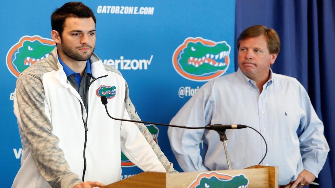 
Florida Gators quarterback Will Grier, left, speaks to members of the media as head coach Jim McElwain listens Monday, Oct. 12, 2015, in Gainesville. Grier was suspended indefinitely for violating the NCAA's policy on banned performance-enhancing drugs. 
