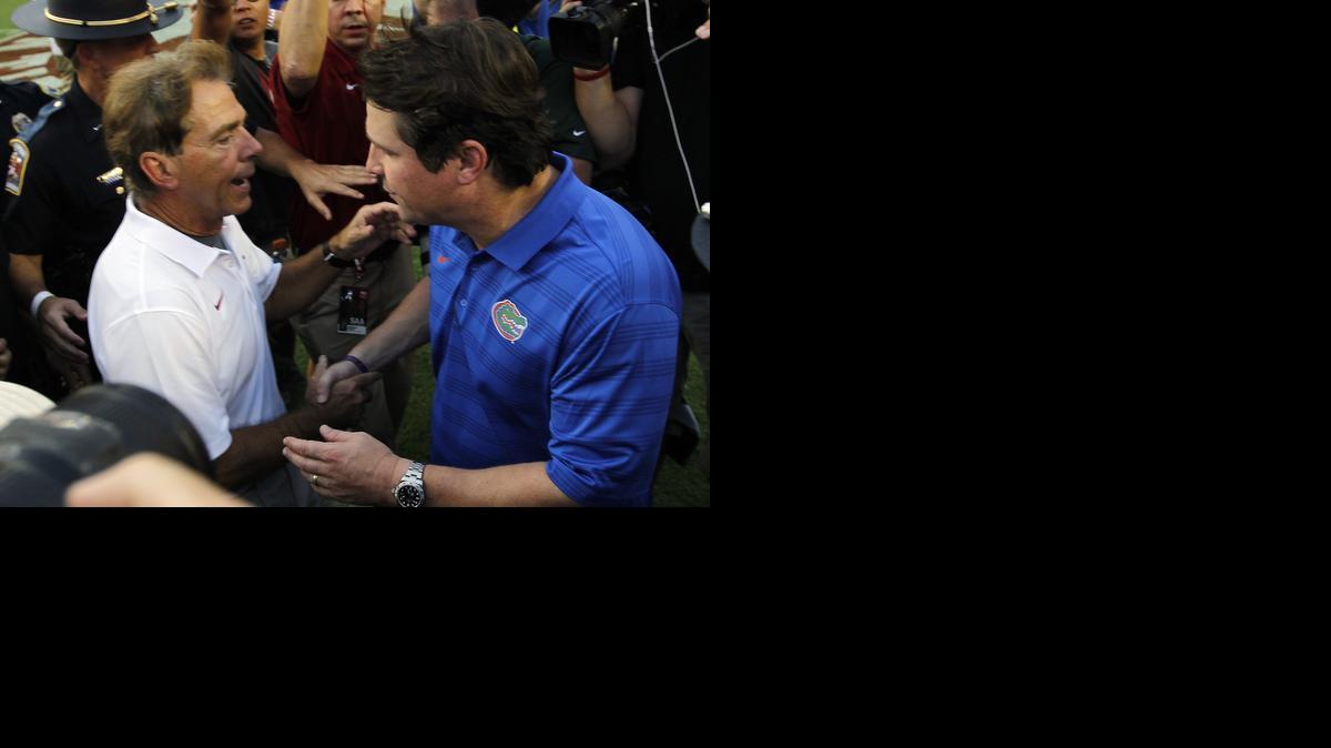 
Alabama head coach Nick Saban, left, meets with Florida head coach Will Muschamp after an NCAA college football game on Saturday, Sept. 20, 2014, in Tuscaloosa, Ala. Alabama defeated Florida 42-21.
