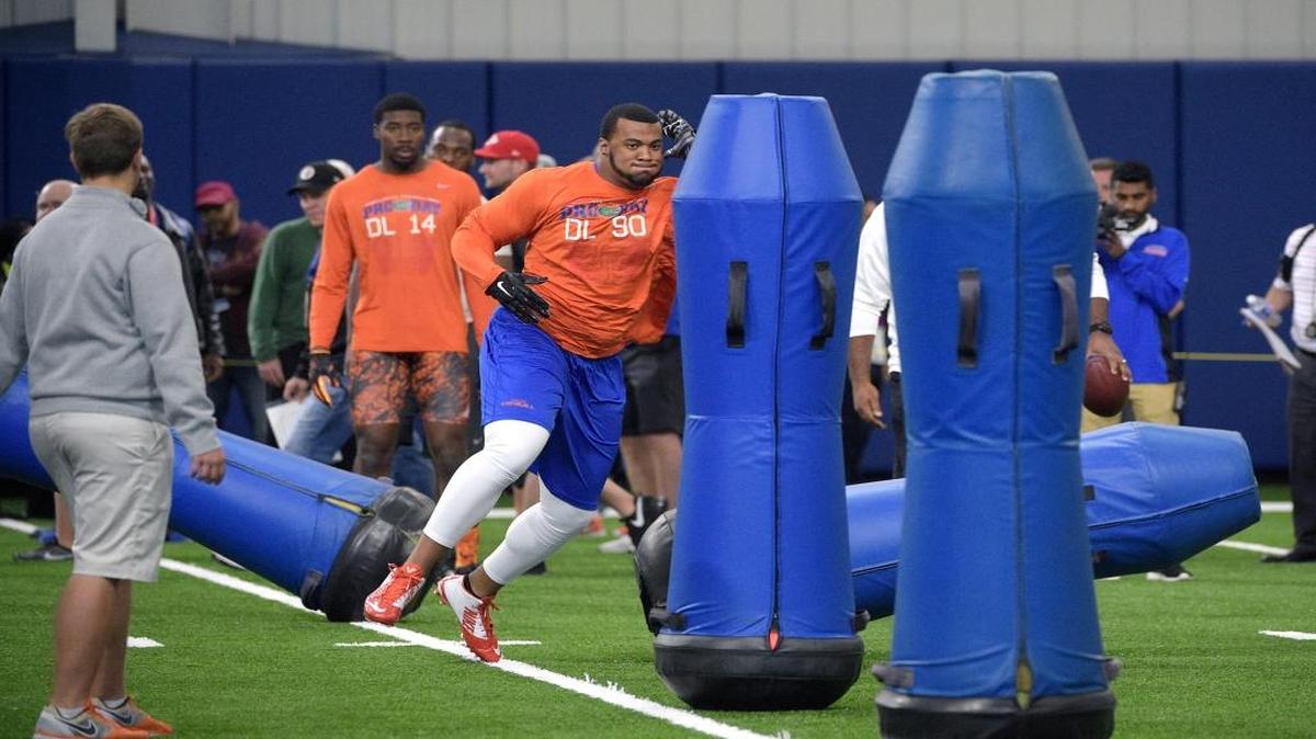 Florida defensive lineman Jonathan Bullard (90) runs through a drill during Florida's NFL Pro Day in Gainesville, Fla., Tuesday, March 22, 2016.