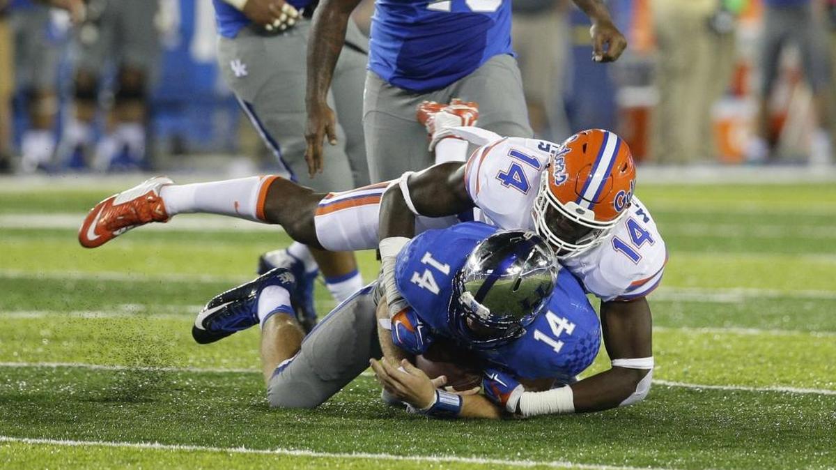 
UF’s Alex McCalister sacks Kentucky’s Patrick Towles during a game Sept. 19, 2015. 
