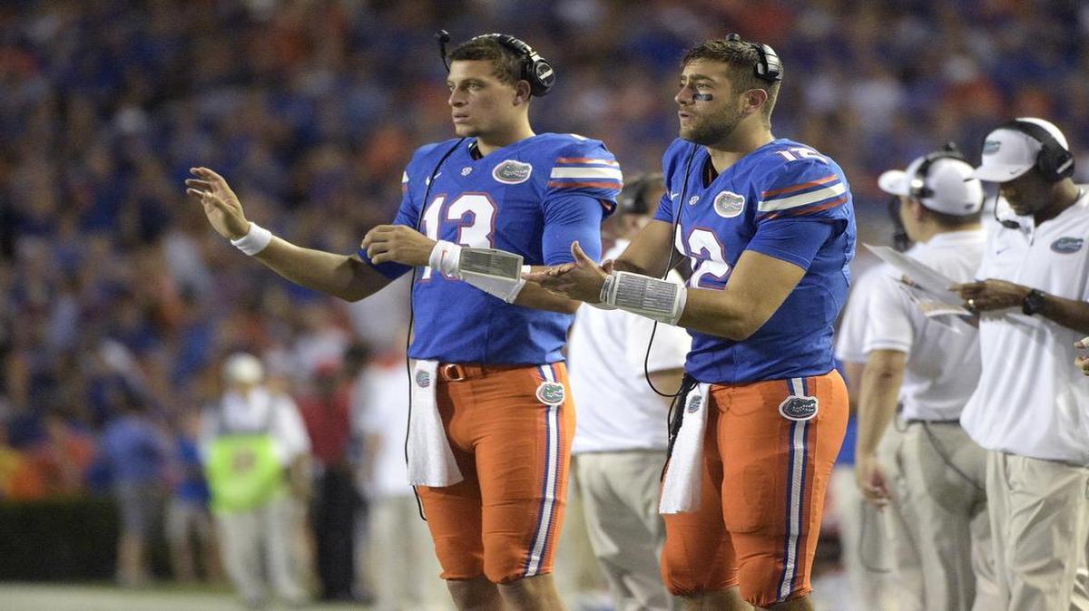 Florida quarterback Feleipe Franks (13) helps to signal in a play from the sideline during the first half of an NCAA college football game against North Texas in Gainesville on Saturday, Sept. 17, 2016.