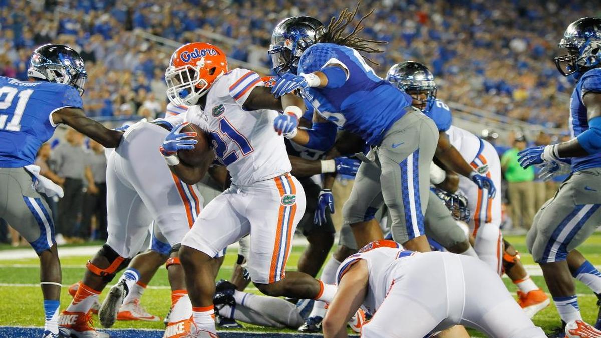 
Florida running back Kelvin Taylor scores a touchdown past Kentucky linebacker Josh Forrest, right, during the first half of an NCAA college football game Saturday, Sept. 19, 2015, in Lexington, Ky. 
