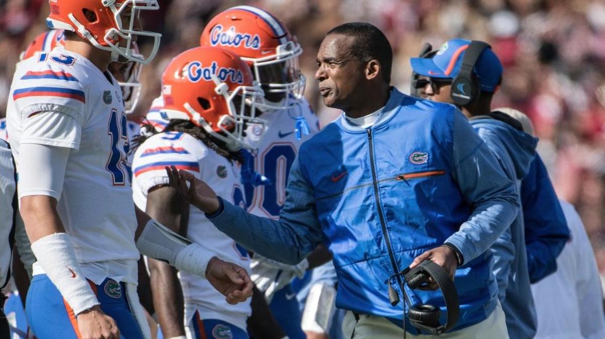 Florida head coach Randy Shannon talks with quarterback Feleipe Franks (13) during the first half of an NCAA college football game Sat., Nov. 11, 2017, in Columbia, S.C. South Carolina defeated Florida 28-20.