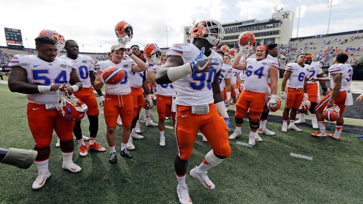 Florida defensive lineman Antonneous Clayton (90) dances as he celebrates with teammates after Florida beat Vanderbilt 13-6 in an NCAA college football game Saturday, Oct. 1, 2016, in Nashville, Tenn.