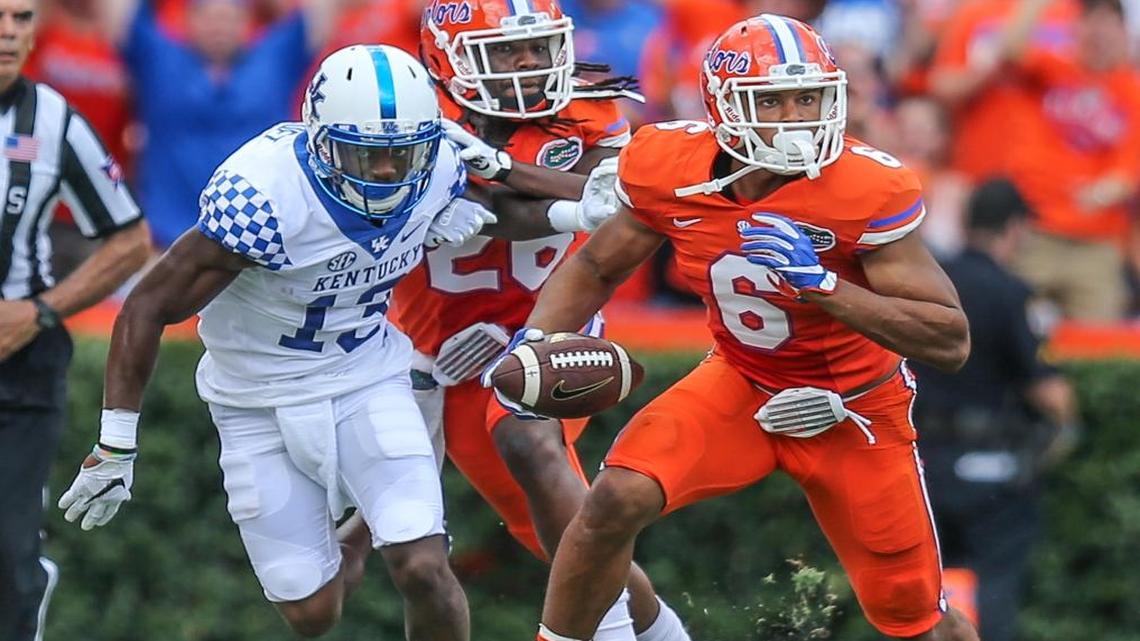 Florida defensive back Quincy Wilson (6) runs the ball after intercepting a pass to Kentucky wide receiver Jeff Badet (13), left, during first half NCAA college football action in Gainesville, Fla., Sat., Sept. 10, 2016.