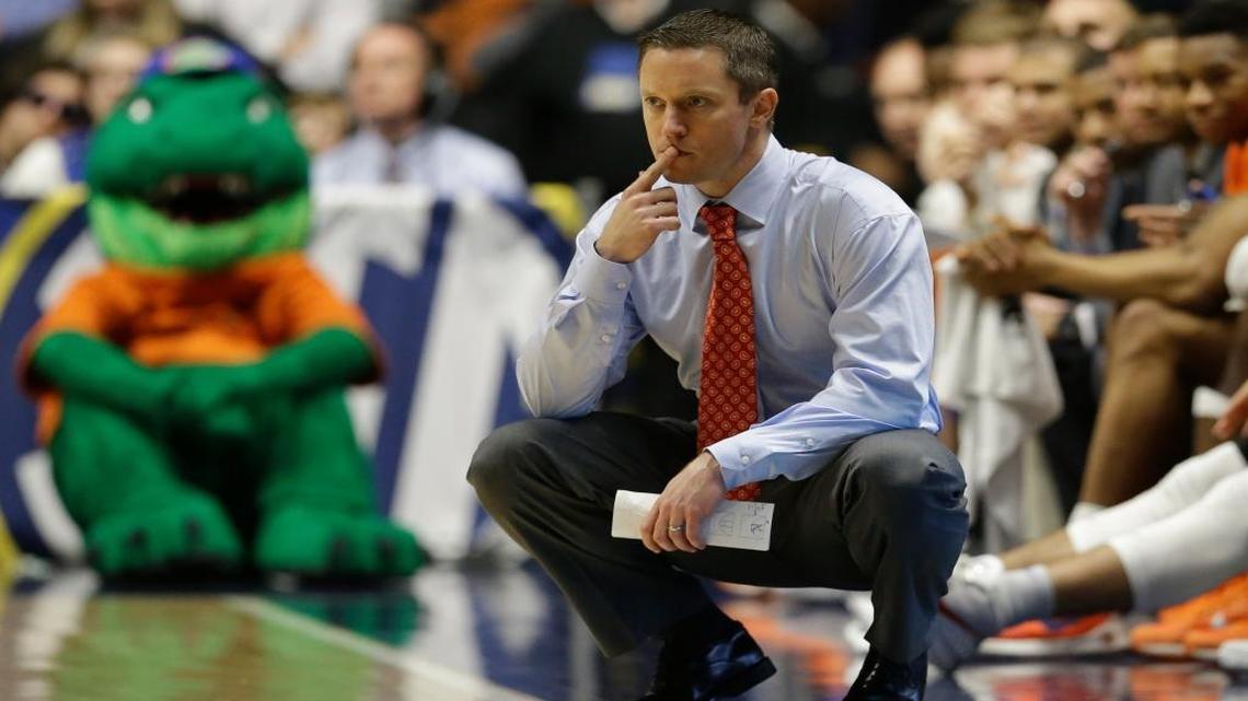 Florida head coach Mike White watches the action during the first half of an NCAA college basketball game against Texas A&M in the Southeastern Conference tournament in Nashville, Tenn., Friday, March 11, 2016.