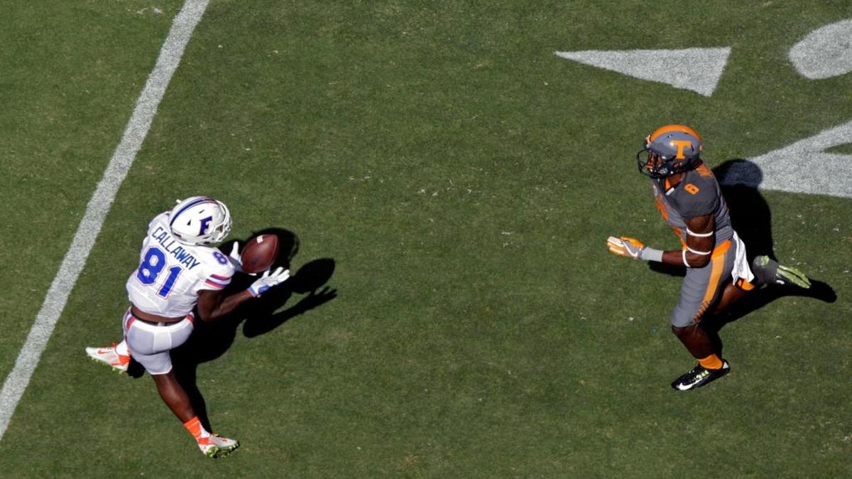 Florida wide receiver Antonio Callaway (81) makes a catch as he's defended by Tennessee defensive back Justin Martin (8) during the first half of an NCAA college football game Saturday, Sept. 24, 2016, in Knoxville, Tenn.