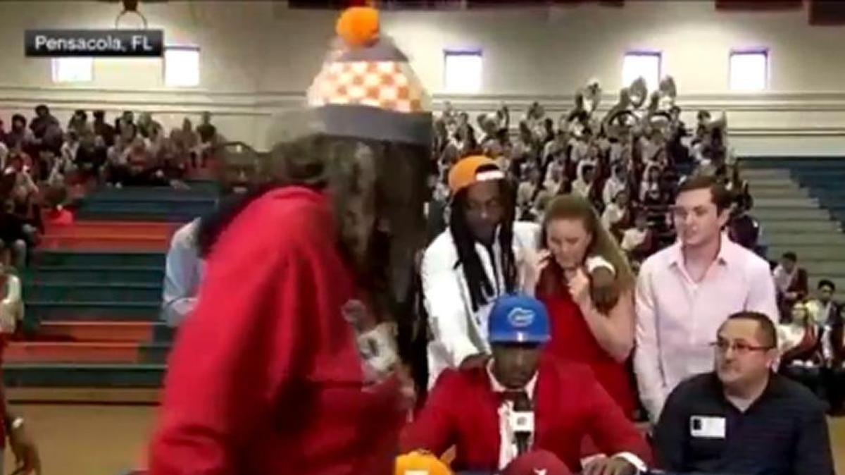 Four-star wide receiver Jacob Copeland committed to the Florida Gators over Alabama and Tennessee on Wednesday. His mom (front) walked away from her son after the announcement before returning to hug her son.