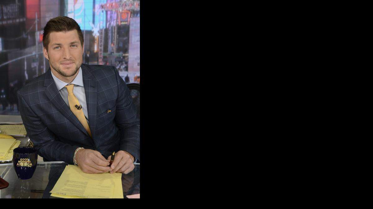 
In this Jan. 31, 2014 photo provided by ABC, ESPN and SEC Network Analyst Tim Tebow is shown in ABC’s Times Square New York studios. Tebow will join Good Morning America as a contributor starting Monday, Sept. 15, 2014. 
