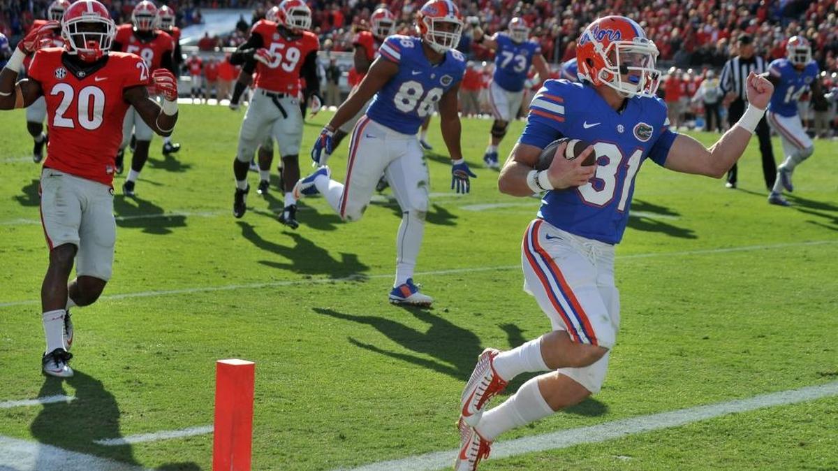 Florida's Michael McNeely scores on a fake field goal in the first half against Georgia during an NCAA college football game Sat., Nov. 1, 2014, in Jacksonville, Fla. Florida won 38-20.