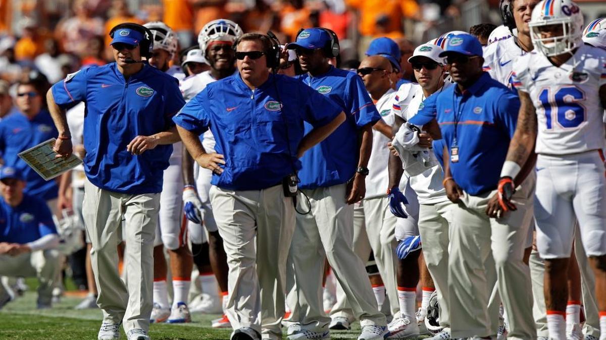 Florida head coach Jim McElwain, second from the left, looks on during the first half of an NCAA college football game against Tennessee Saturday, Sept. 24, 2016, in Knoxville, Tenn.