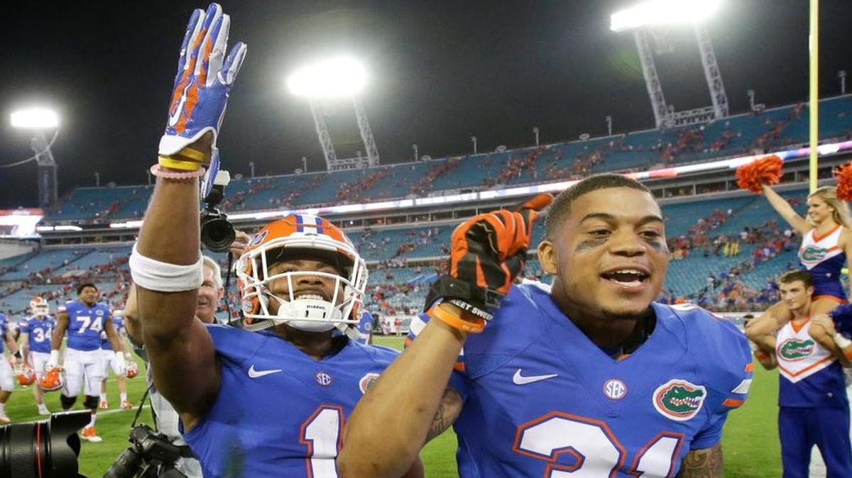 Florida defensive backs Vernon Hargreaves III (1) and Jalen Tabor (31) celebrate after defeating Georgia 27-3 on Saturday, Oct. 31, 2015, in Jacksonville, Fla.