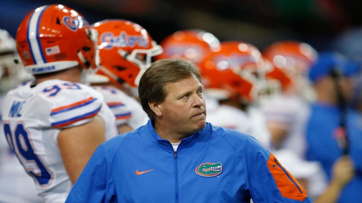 Florida head coach Jim McElwain walks before the first half of the Southeastern Conference championship NCAA college football game between Alabama and Florida, Saturday, Dec. 5, 2015, in Atlanta.
