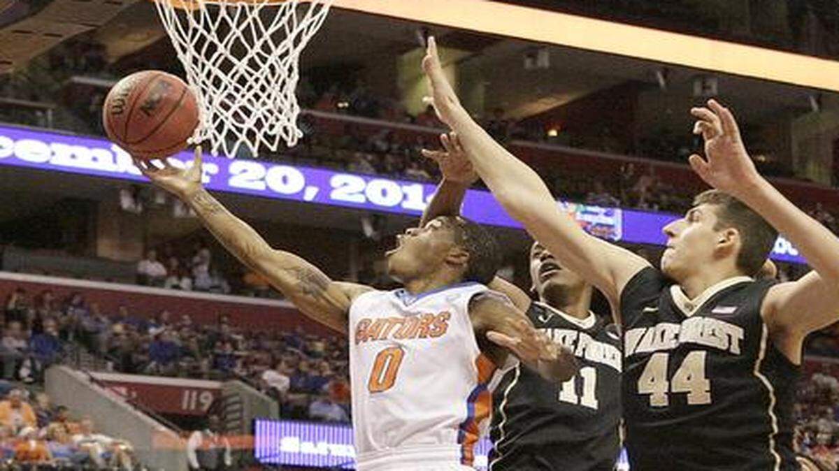 
UF’s Kasey Hill (0) attempts a shot during the Metro PCS Orange Bowl Basketball Classic game against Wake Forest Demon Deacons on Saturday, December 20, 2014 at BB&T Center in Sunrise.

