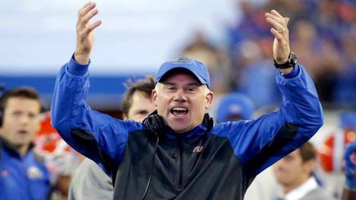 
UF defensive coordinator D.J. Durkin coaches from the sideline during a game against Georgia in Jacksonville, Fla., Saturday, Nov. 1, 2014.

