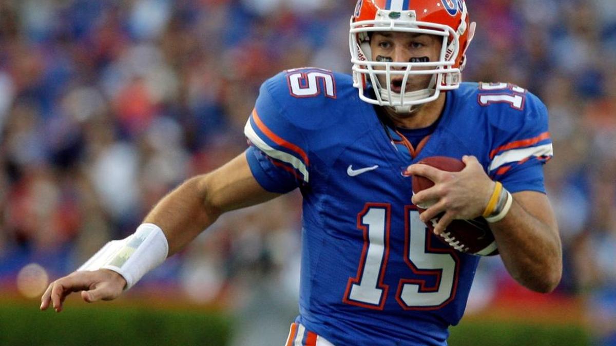
In this Oct. 17, 2009, file photo, Florida quarterback Tim Tebow scrambles against Arkansas in Gainesville, Fla. 
