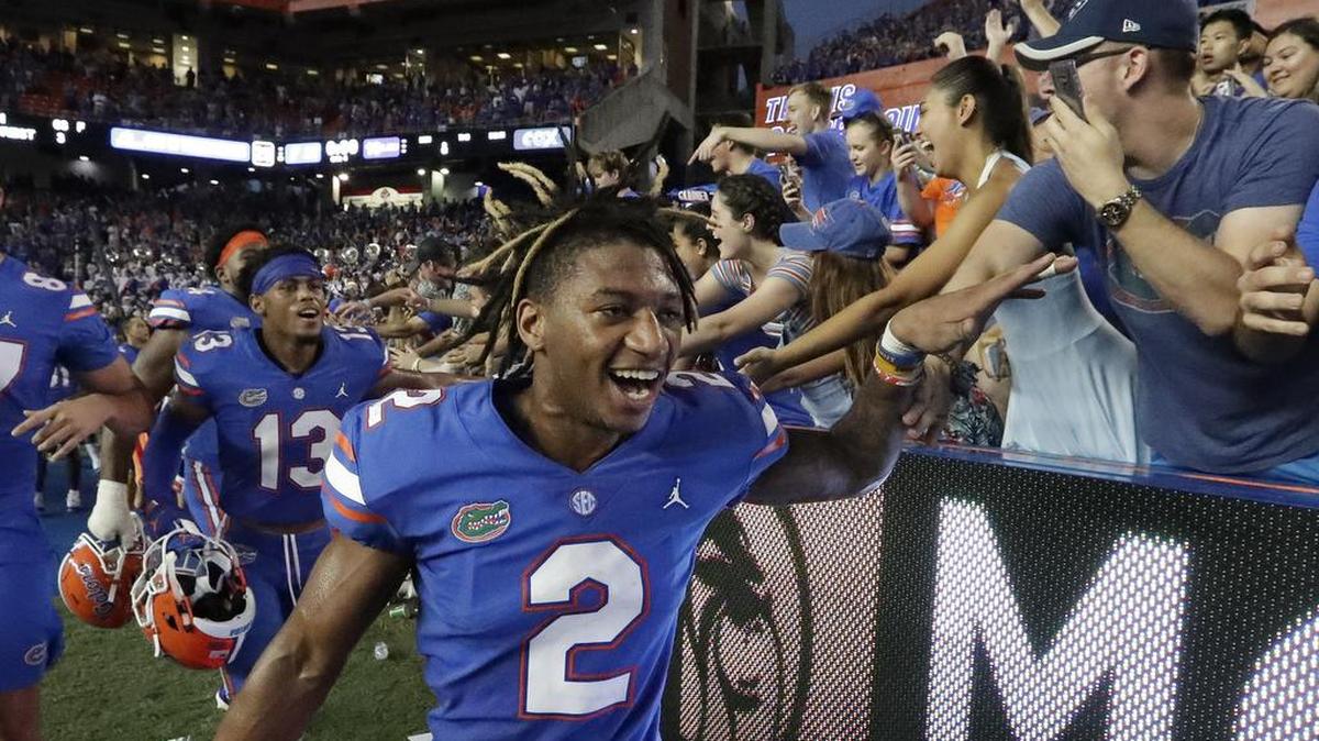 Florida defensive back Brad Stewart Jr. (2) celebrates with fans at Ben Hill Griffin Stadium after the Gators’ upset of LSU on Saturday. Stewart’s interception and touchdown in the final minutes of the game to help seal the win for Florida.