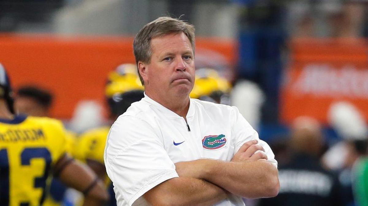 This is a Sept. 2, 2017, file photo showing Florida head coach Jim McElwain watching his team warm up before an NCAA college football game against Michigan, in Arlington, Texas. McElwain says players and families have received death threats amid the team’s struggles, adding “there’s a lot of hate in this world and a lot of anger.” McElwain declined to say Monday, Oct. 23, 2017, whether he personally received death threats.