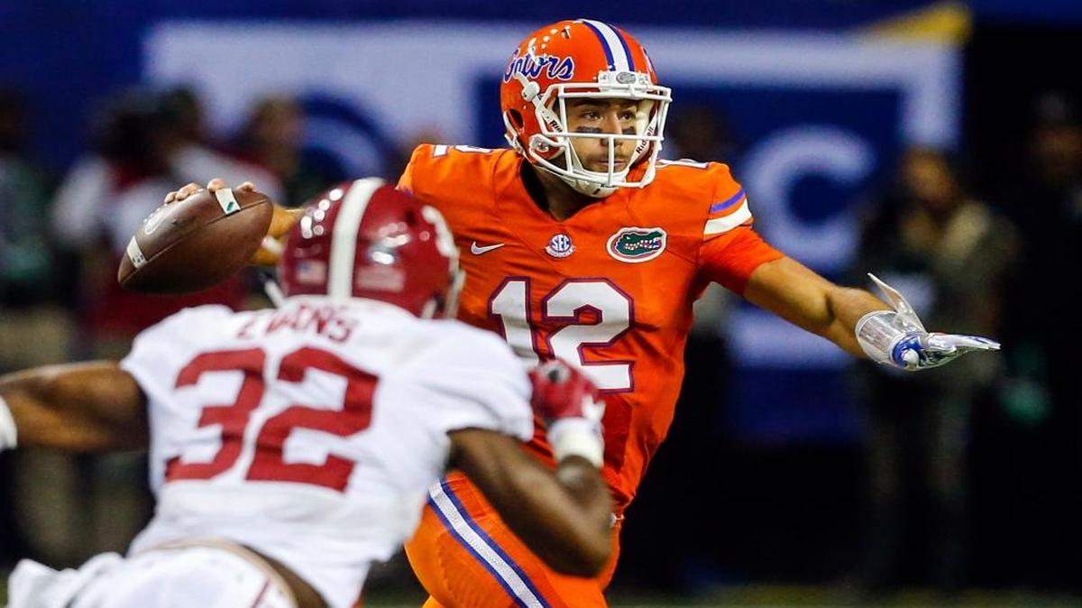 Florida quarterback Austin Appleby (12) scrambles as he tries to pass against Alabama during the first half of the Southeastern Conference championship NCAA college football game, Sat., Dec. 3, 2016, in Atlanta.