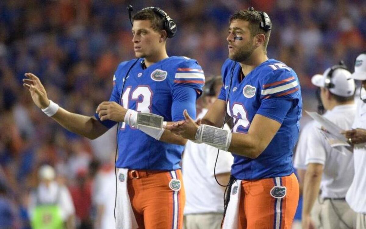Florida quarterback Austin Appleby (12) and quarterback Feleipe Franks (13) signal in a play from the sideline during the first half of an NCAA college football game against North Texas in Gainesville, Fla., Sat., Sept. 17, 2016.