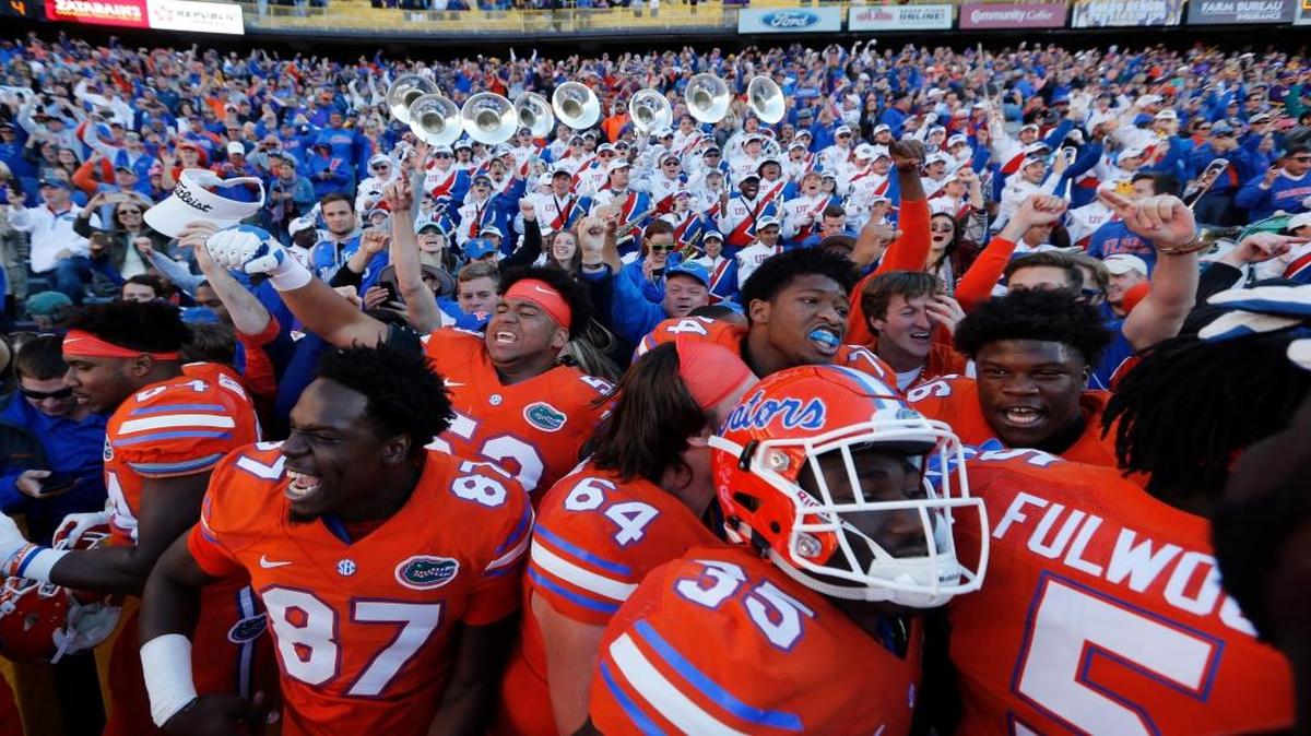 Florida celebrates with fans after defeating LSU in an NCAA college football game in Baton Rouge, La., Saturday, Nov. 19, 2016. Florida won 16-10.