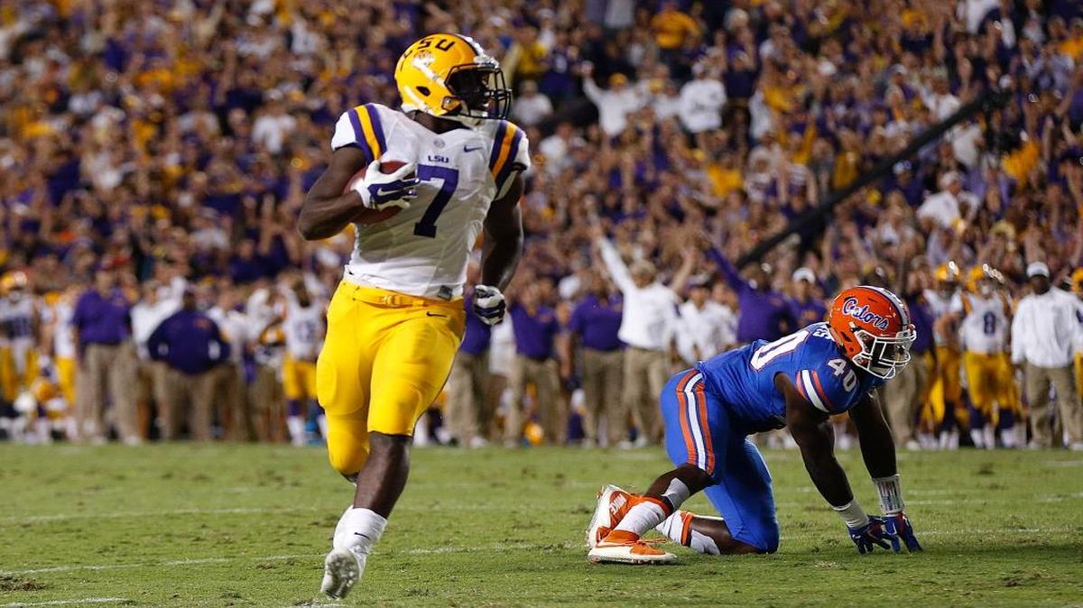 LSU running back Leonard Fournette (7) carries for a touchdown past Florida linebacker Jarrad Davis (40) in the first half of an NCAA college football game in Baton Rouge, La., Sat., Oct. 17, 2015.