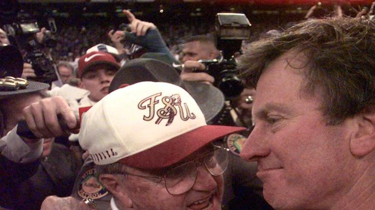 Florida State Seminoles coach Bobby Bowden, left, congratulates Florida Gators coach Steve Spurrier after the Gators won 52-20 in the Sugar Bowl at the Superdome in New Orleans Thursday Jan. 2, 1997.