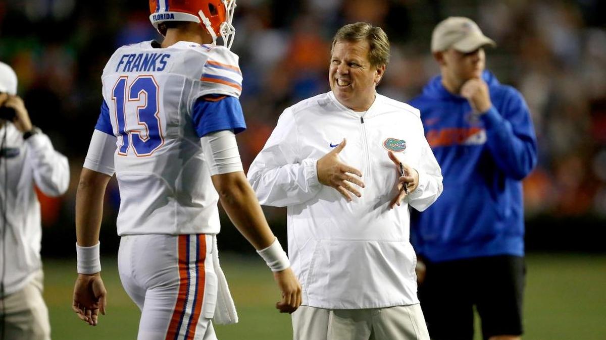 Florida coach Jim McElwain talks to quarterback Feleipe Franks during the 2017 spring game in Gainesville.