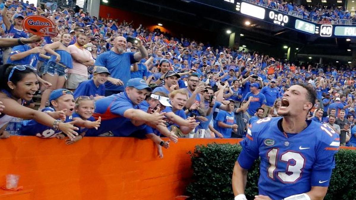 Florida quarterback Feleipe Franks (13) celebrates with fans after he threw a 63-yard touchdown pass as time expired to defeat Tennessee 26-20 in an NCAA college football game, Saturday, Sept. 16, 2017, in Gainesville, Fla.