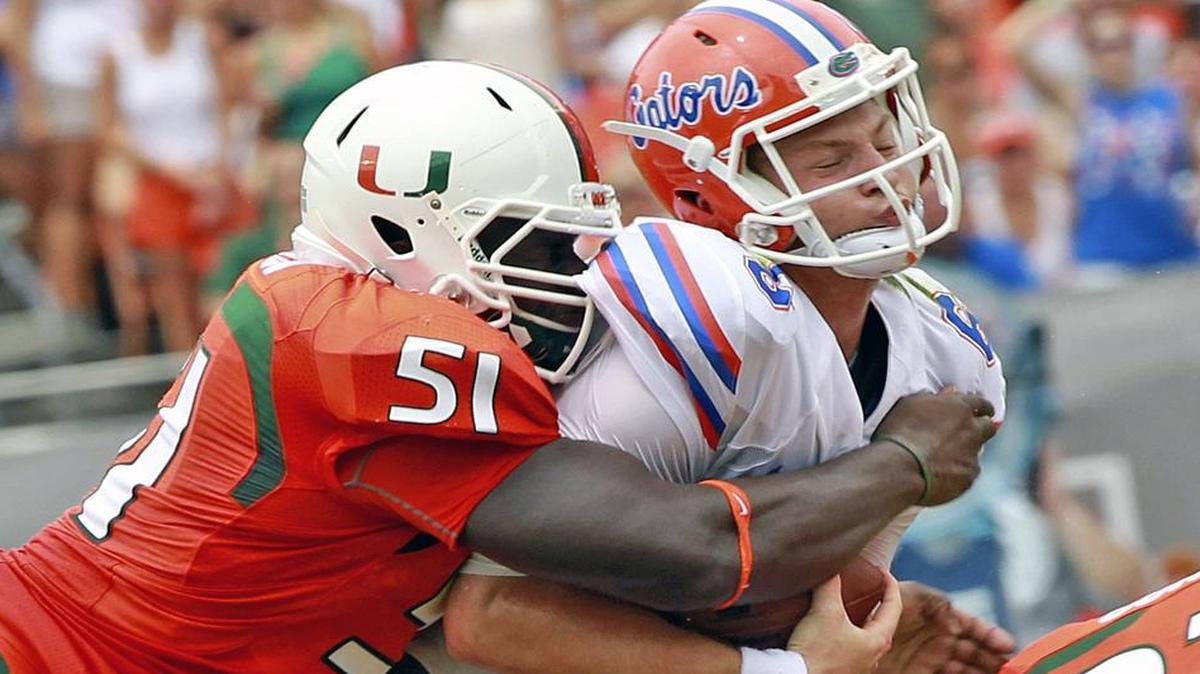
UM’s Shayon Green sacks Florida quarterback Jeff Driskel in the third quarter at Sun Life Stadium in Miami Gardens, Florida, Sept. 7, 2013.
