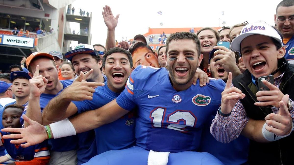 Florida quarterback Austin Appleby (12) celebrates with fans after defeating South Carolina 20-7 in an NCAA college football game, Saturday, Nov. 12, 2016, in Gainesville, Fla.