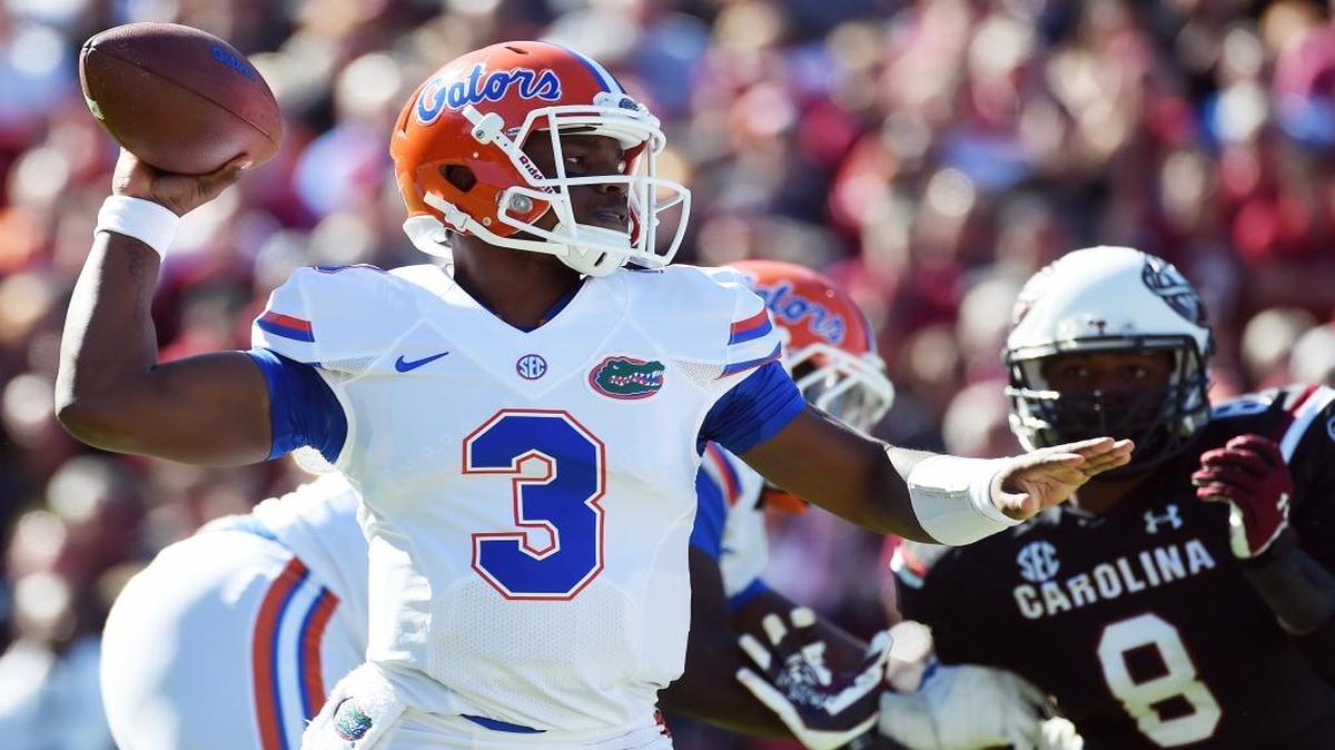 Florida quarterback Treon Harris (3) throws a pass as South Carolina defensive end Marquavius Lewis (8) pressures during the first half of an NCAA college football game, Saturday, Nov. 14, 2015, in Columbia, S.C.