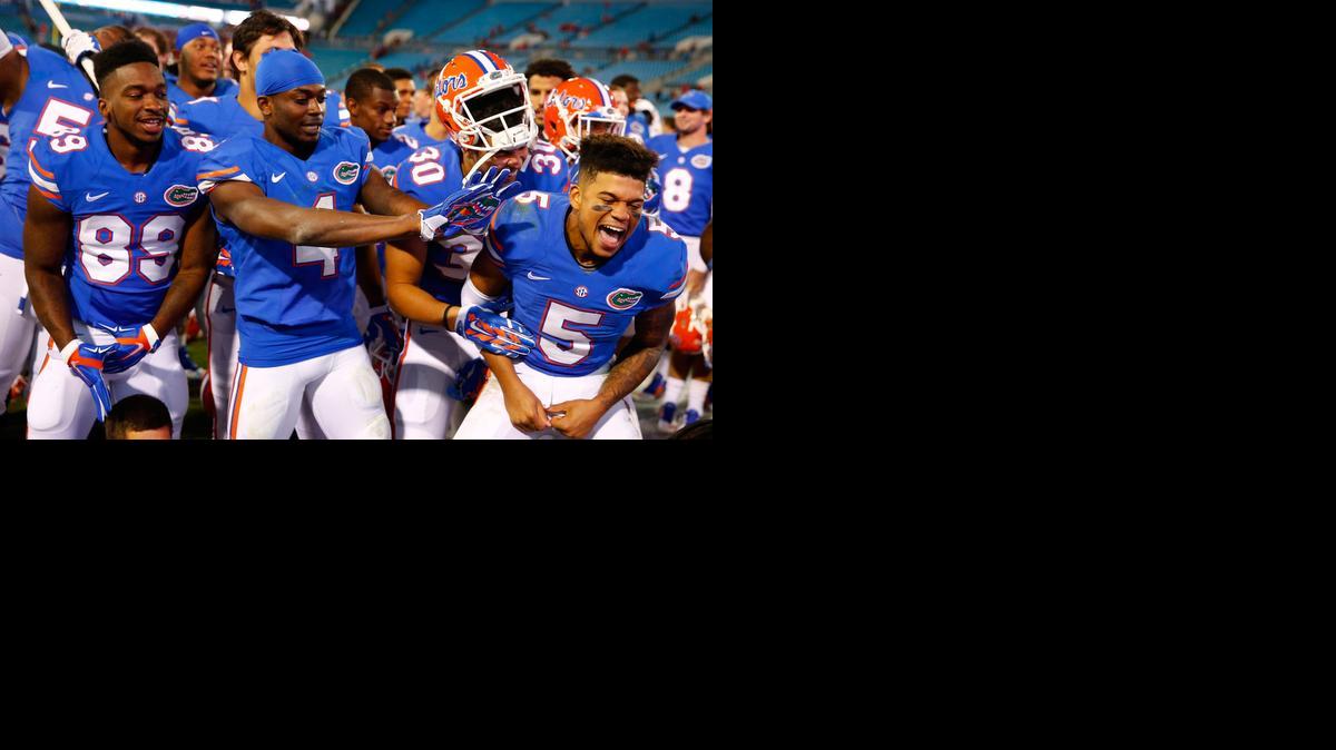 
 Florida Gators players celebrate following a 38-20 victory over the Georgia Bulldogs at EverBank Field on November 1, 2014 in Jacksonville, Florida. 
