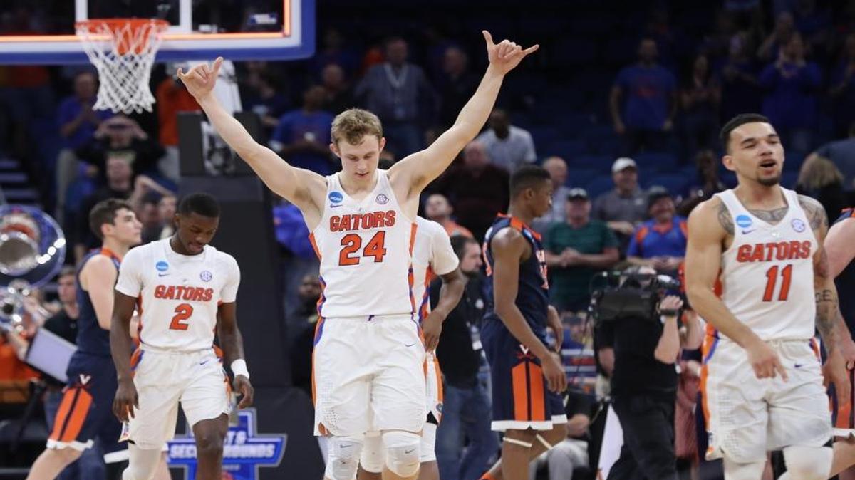 Canyon Barry (24) of the Florida Gators celebrates their 65-39 win over the Virginia Cavaliers during the second round of the 2017 NCAA Men's Basketball Tournament at the Amway Center on March 18, 2017 in Orlando, Florida.