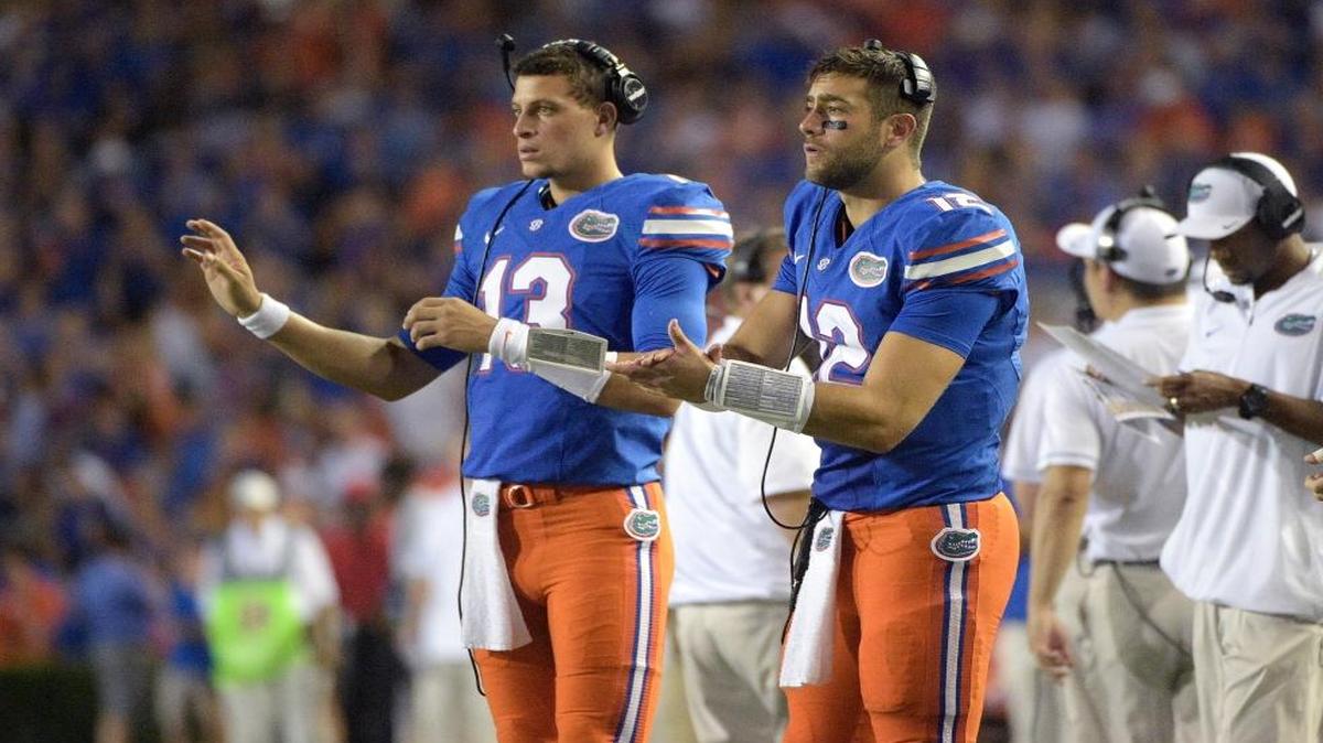 Florida quarterback Austin Appleby (12) and quarterback Feleipe Franks (13) signal in a play from the sideline during the first half of an NCAA college football game against North Texas in Gainesville, Fla., Saturday, Sept. 17, 2016.