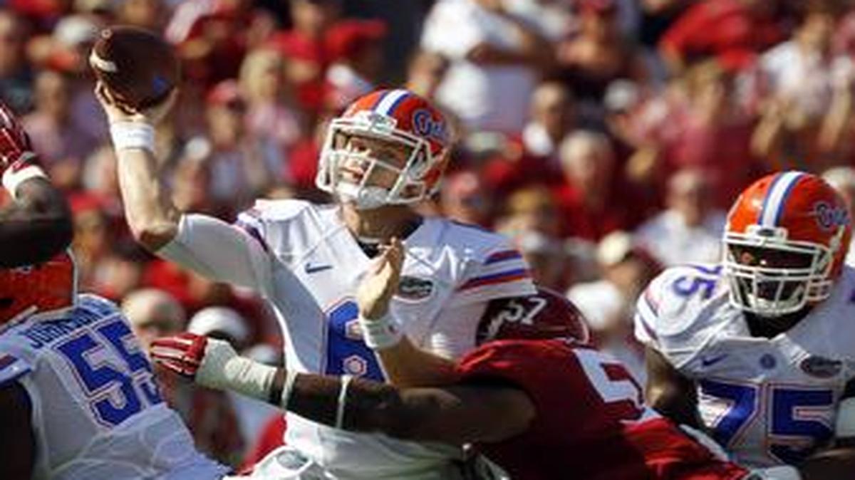 
Florida quarterback Jeff Driskel (6) throws a pass while under pressure from Alabama lineman D.J. Pettway (57) on Saturday. Driskel completed only 9 of 28 passes for 93 yards.
